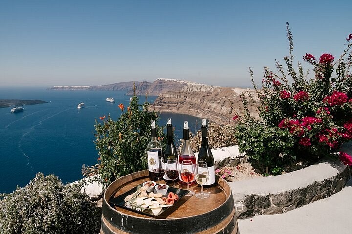 Santorini wine tasting and volcanic vineyards near Venus Sunrise Vourvoulos⁠